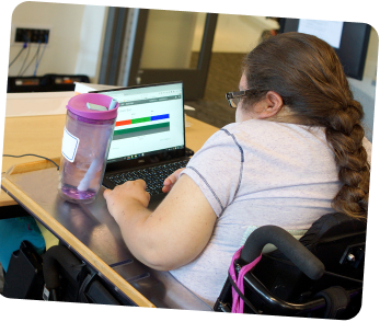 Woman in wheelchair using a laptop